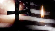 Memorial Day. Cross with US flag and one candle.
