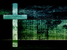cross on dark background of boards in green and black