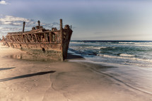 rusty old boat on a shore 