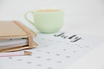 planner, calendar, pencil, and mug
