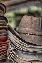 Stacks of cowboy hats.