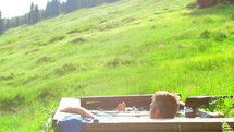 a man in an outdoor tub 