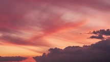 Orange sky clouds at sunset