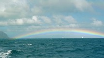 Rainbow over the blue ocean