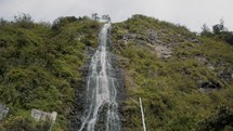 Low angle of Cascada de la virgen in Baños, Ecuador	