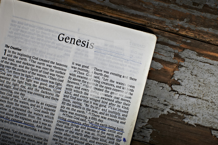 A Bible open to the book of Genesis