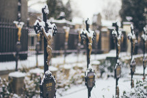 crucifix memorial markers in snow 