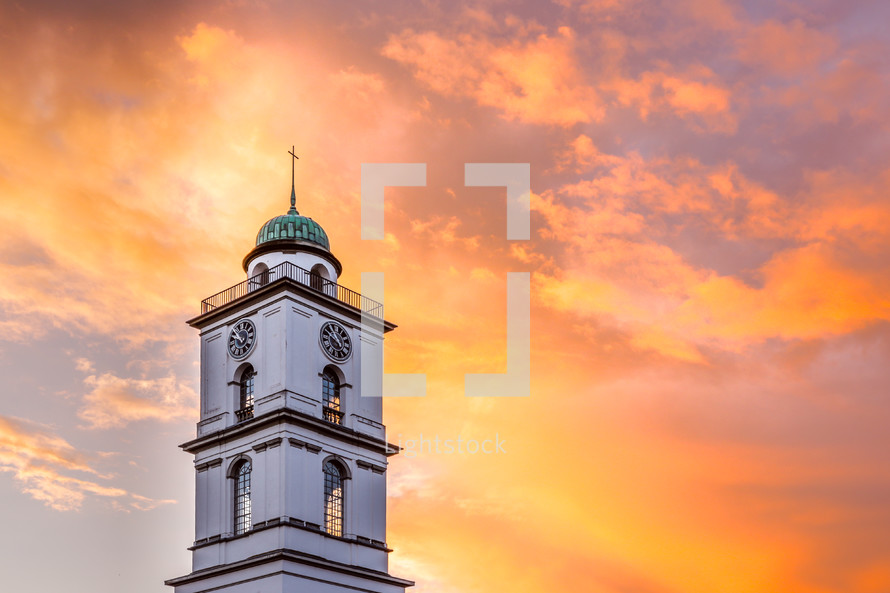 a steeple at sunset 