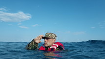Soldier Salutes Underwater
