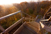 Wood and metal watchtower staircase leading up to view of autumn trees in Bickle Knob, West Virginia 