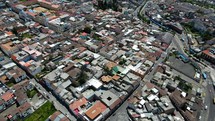 Aerial shot drone flies over neighborhood just outside of downtown Quito