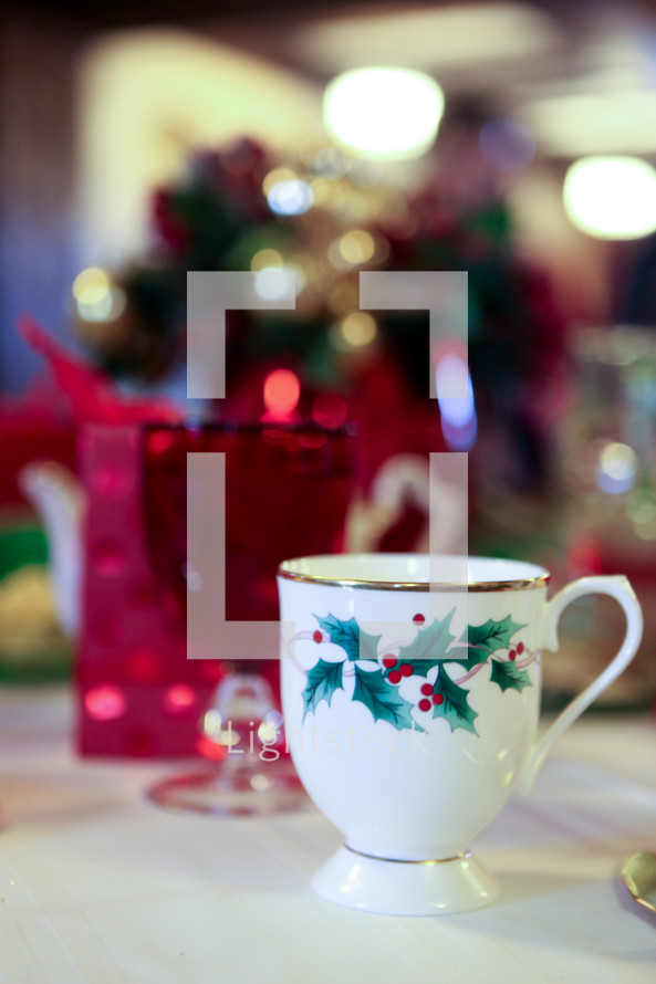 Christmas cup and glass on a table.