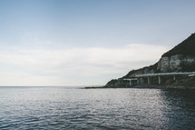 a highway curving around sea cliffs 