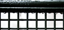 rain drops on a railing