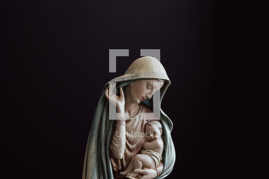 Mary and baby Jesus on a black background