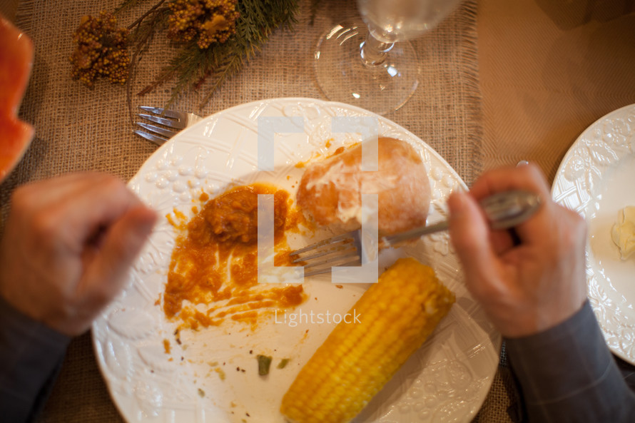 man eating a Thanksgiving dinner 