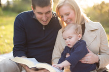 family of three reading bible
