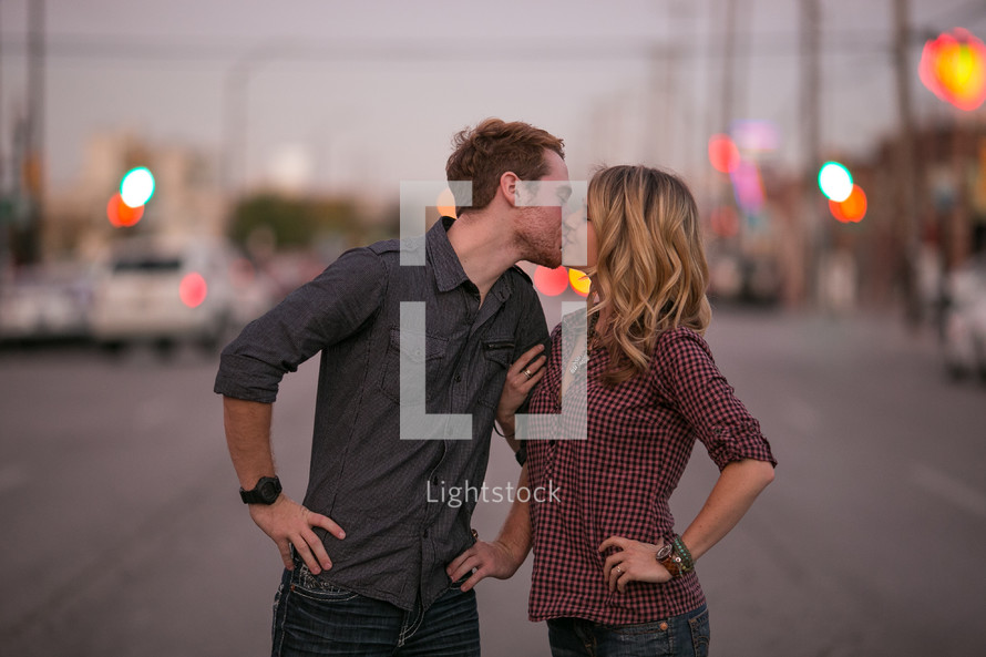 Couple kissing on a street