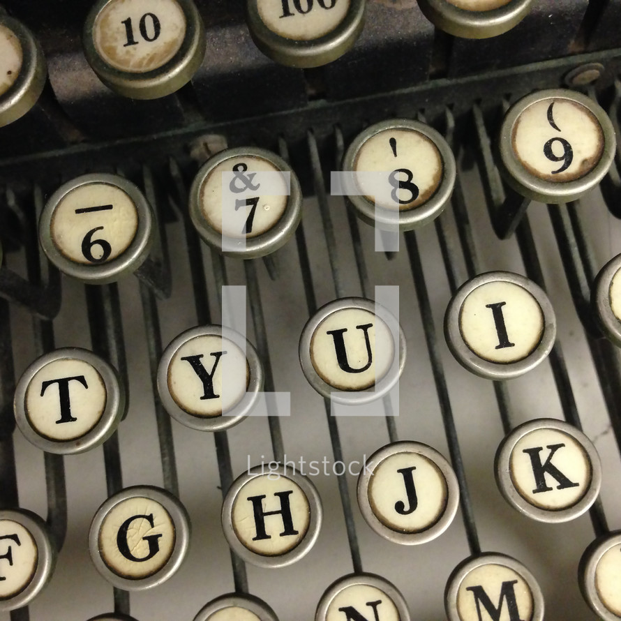 closeup of letter and number keys of a vintage typewriter