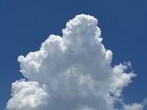 billowing white cloud and blue sky
