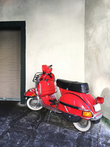 red vintage scooter parked 