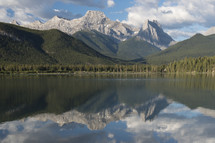 Mountains reflected in a placid lake.