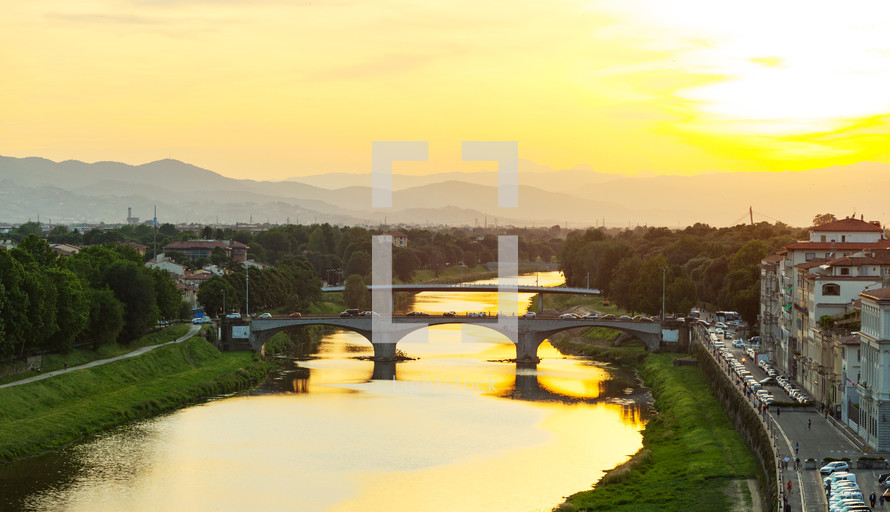 View of the river Arno and Ponte Santa Trinita at sunset in Florence.