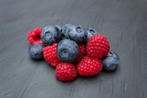 Blueberries and Raspberries on a Grey Slate
