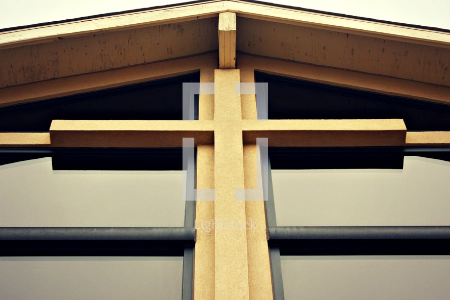 wood cross on the front of a church 