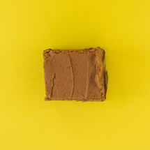 chocolate cake on a yellow background 