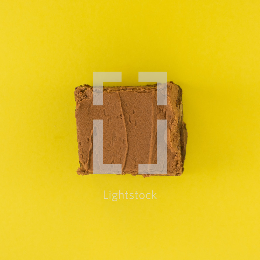 chocolate cake on a yellow background 