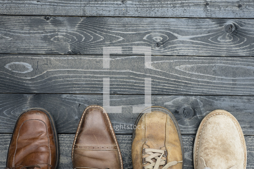 men's footwear on wood boards 