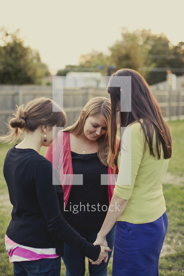 Women praying in circle