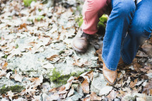 a couples feet on fall leaves 