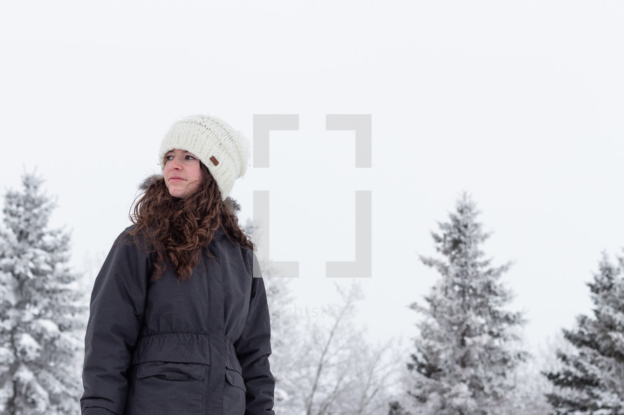teen girl in a coat outdoors in winter 