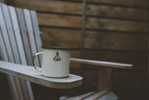 coffee mug on an adirondack chair 
