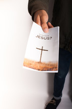 A person holding out a pamphlet entitled, "Do You Know Jesus?"
