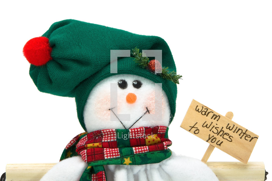 smiling snowman holding a sign that reads warm winter wishes to you
