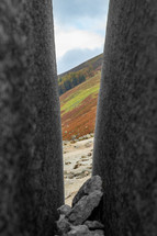 View of Mountains Through a Split Boulder