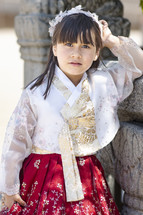 A little girl in a traditional Korean princess dress