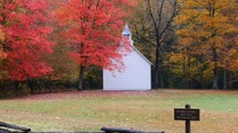 small white church in autumn 