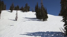 riding a ski lift up a mountain slope 