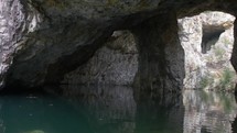 Pan of Beautiful Rock Caves with clear water