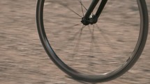 bike wheel on a dirt road 