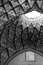 ornate tiles on a dome inside a mosque in Iran 