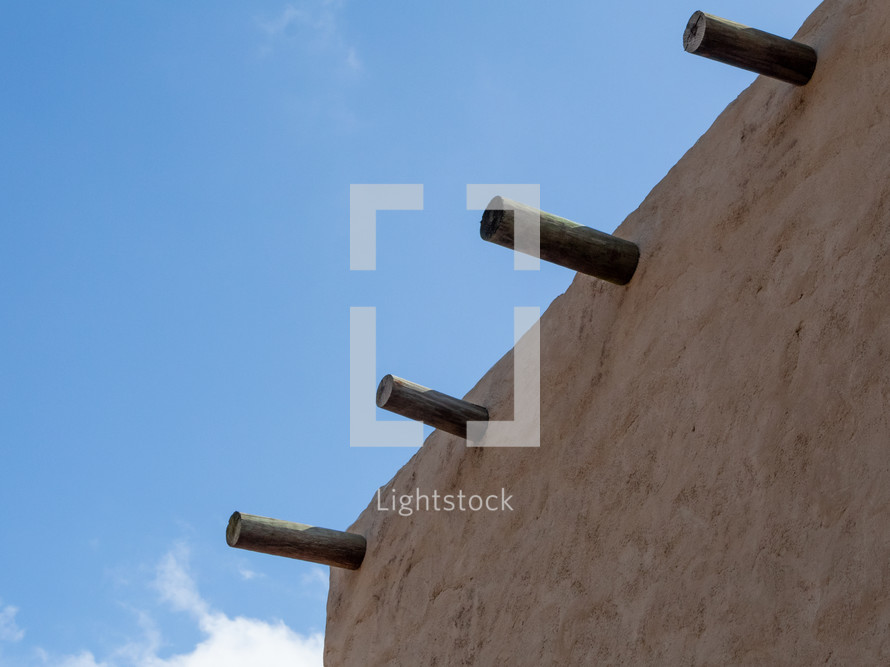 Wooden Poles On the Roof of an Ancient Middle Eastern House