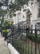 wrought iron fence in front of a house 