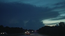 lightning in the night sky while driving 