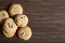 chocolate chip cookies on a wood background 