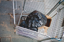trash in a cage from a building under construction 